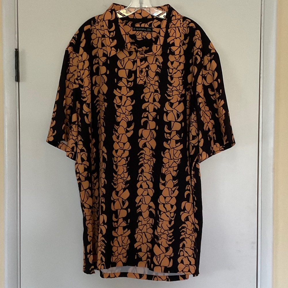 Manaola “Puakenikeni” Black and Orange Botanical Polo
